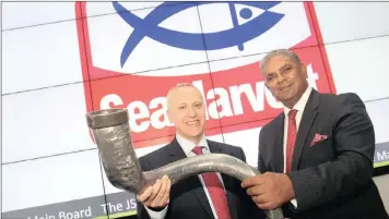  ??  ?? Sea Harvest chief executive Felix Ratheb, and Fred Robertson, chairman of Brimstone Investment Group Corporatio­n, blowing the kudu horn to mark the company’s listing yesterday. PHOTO: SUPPLIED