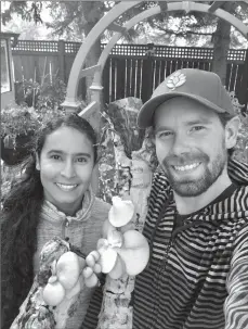  ?? Submitted photo ?? Adriana Navarro Borrell and husband Chase Morrell with some of their mushroom logs.