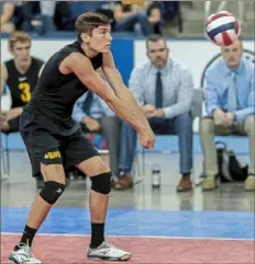  ??  ?? North Allegheny junior defensive specialist Kyle Davies records a dig during the PIAA Class 3A title match. Davies also served as a manager for the Tigers girls team, thus receiving two PIAA gold medals in the same sport.