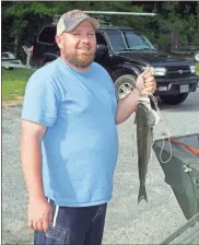  ?? Doug Walker ?? Allen Abernathy, Taylorsvil­le, with one of the striped bass he caught in the Etowah River on Saturday morning at Neel’s Landing.