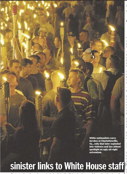  ??  ?? White nationalis­ts carry torches at Charlottes­ville, Va., rally that later exploded into violence and has shined spotlight on ugly alt-right extremism.