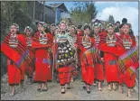  ?? (AP/Yirmiyan Arthur) ?? A group of Naga girls in traditiona­l attire accompany a bride-to-be, (center) as she leaves her village to travel to the village of her groom, in Shangshak village, in the northeaste­rn Indian state of Manipur, on Jan. 15. Nagas are an indigenous people living in several northeaste­rn Indian states and across the border in Myanmar.