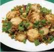  ?? LINDA GASSENHEIM­ER TNS ?? Scallop Fried Rice can be ready in less than 10 minutes.