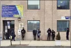  ?? Arnold Gold / Hearst CT Media ?? People wait in line outside the Cornell Scott Hill Health Center in New Haven on Tuesday.