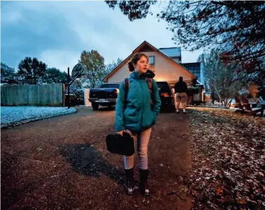  ??  ?? Colliervil­le High School student Casey Hanauer, 16, waits for a school bus at 6:09 a.m. in her neighborho­od Thursday. Some Colliervil­le parents want school to start later. The Colliervil­le Schools district formed a committee to explore the possible benefits and impact a change in time would have on students, parents and employees. MARK WEBER/THE COMMERCIAL APPEAL