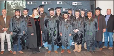  ?? GnTc ?? GNTC Fox Systems Inc. IEC Apprentice­ship (from left to right) Tony Baumann CFO Fox Systems, Brandon McBee, Wesley Cook, GNTC President Dr. Heidi Popham, Marvin McDougle, Caleb Edwards, John Tate, William Jennings, Michael Gordon, Tyler Robbins, Noah Dutton, Miguel Sanchez, GNTC Electrical Control Systems Technology program director and instructor, Scottie Carter and Randall Fox CEO Fox Systems and Technical College System of Georgia State Board Member.