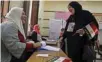  ?? - Reuters ?? EXERCISING FRANCHISE: A woman casts her vote at a polling station during the presidenti­al election in Cairo, Egypt March 26, 2018.