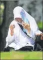  ??  ?? A woman prays at a mass grave for the victims of the 2004 tsunami, in Banda Aceh.
AP