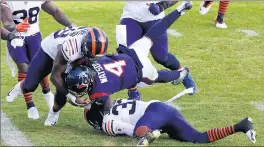  ??  ?? Houston Texans quarterbac­k Deshaun Watson is tackled by Jaylon Johnson (33) and Danny Trevathan.