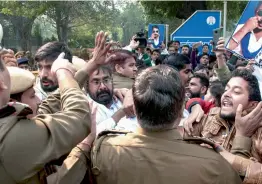  ?? — PTI ?? Bheem Sena activists clash with the police during a protest against Uttar Pradesh CM Yogi Adityanath over the arrest of their leader Chandrashe­khar Azad in New Delhi on Tuesday.