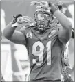  ?? MATT FREED/AP ?? Pittsburgh’s Patrick Jones II celebrates a sack of Louisville’s Malik Cunningham on Saturday.