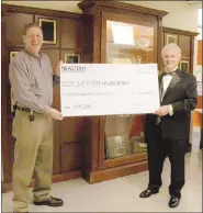  ?? MEDIANEWS GROUP FILE ?? Automotive technology instructor John McDonald presents a check for $5,228.50 to George Marin, Eastern Center for Arts and Technology Foundation president.