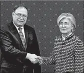  ?? LEE JIN-MAN/GETTY ?? Chief U.S. negotiator Timothy Betts greets South Korean Foreign Minister Kang Kyung-wha in Seoul on Sunday.