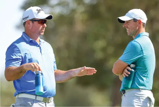  ?? Photo / Getty Images ?? New Zealand’s Ryan Fox and Northern Ireland’s Rory McIlroy shoot the breeze during the DP World Tour Championsh­ip in Dubai.