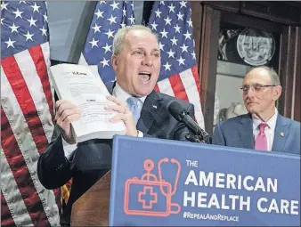  ?? [J. SCOTT APPLEWHITE/THE ASSOCIATED PRESS] ?? House Majority Whip Steve Scalise of Louisiana holds up a copy of the original Affordable Care Act while touting Republican­s’ replacemen­t bill at a Capitol Hill news conference Wednesday.