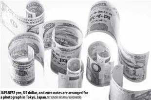  ?? Misawa/bloomberg ?? Japanese yen, Us dollar, and euro notes are arranged for a photograph in Tokyo, Japan.tatsunori