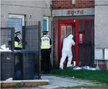  ?? Picture: Robert Perry ?? Police and forensics were at the scene in Camelon Crescent, Blantyre