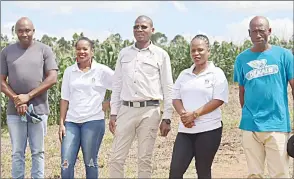  ?? (Courtesy pic) ?? NMC CEO Mavela Vilane (C) with NMC staff and farmers from Nhlangano.