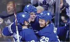  ?? RENÉ JOHNSTON/TORONTO STAR ?? Auston Matthews, centre, celebrates his second goal of the second period, the one that wasn’t overturned after a video review.