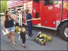  ?? VALLEY PRESS FILES ?? Zayden Herrington of Mojave gets a close look at a Fire Station 129 HazMat truck, in August 2016, at the City of Lancaster’s sixth annual Public Safety Fair and Emergency Expo in downtown. This year’s event is planned for Thursday.