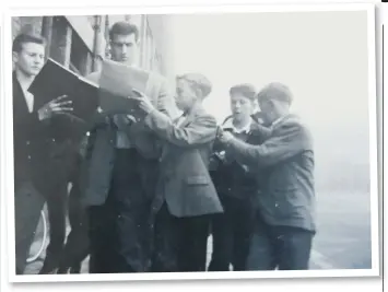  ??  ?? George Aitken is mobbed by young fans wanting autographs.