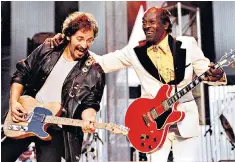  ??  ?? Performing Johnny B Goode in 1995 with Bruce Springstee­n, one of his biggest fans