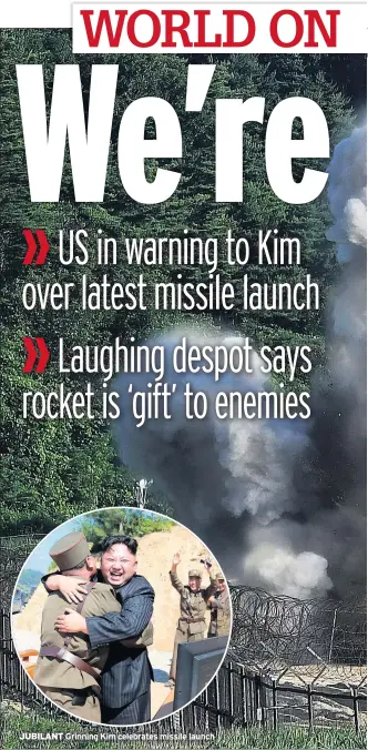  ??  ?? JUBILANT Grinning Kim celebrates missile launch