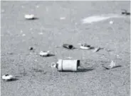  ?? (Photos: AFP) ?? A picture shows a tear gas canister on the ground outside the police station of Champigny-sur-marne, outside Paris, on October 11, 2020, the morning after the station was attacked by around 40 people launching fireworks.