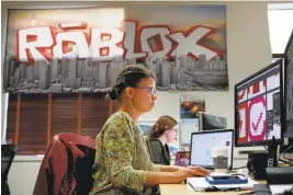  ??  ?? Rita Poutivskai­a works on product and design at Roblox’s headquarte­rs in San Mateo.