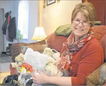  ?? BRENDAN AHERN/THE NEWS ?? Kathy Gratto surrounded by her material of choice inside her Trenton home.