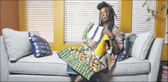  ?? Erik Verduzco Las Vegas Review-Journal @Erik_Verduzco ?? “To be black is to be aware that there is not only beauty in surviving, but also in surviving so beautifull­y,” says Erica Vital-Lazare, who displays a quilt she made.