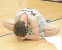  ?? JEFF VORVA/DAILY SOUTHTOWN ?? Lincoln-Way West’s Colin Dargan does a butterfly deep stretch during the player introducti­ons before a home SouthWest Suburban Conference match against Lincoln-Way Central on Tuesday.