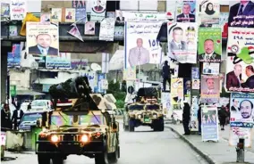  ?? (الوطن) ?? لافتات المرشحين تنتشر بالشوارع العراقية