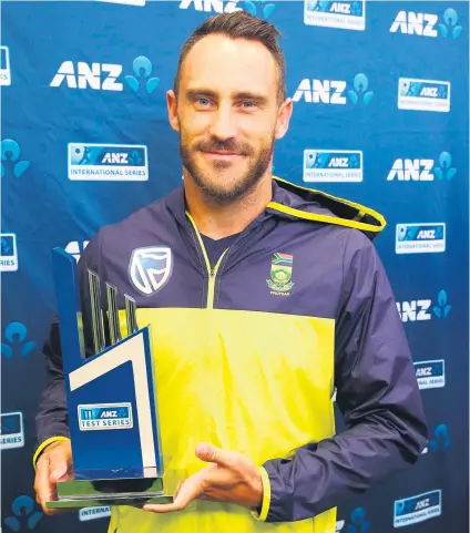  ?? Picture: AFP ?? PROUD. Proteas’ captain Faf du Plessis holds the series trophy at the end of the drawn third Test against New Zealand. The result meant the Proteas won the series 1-0.