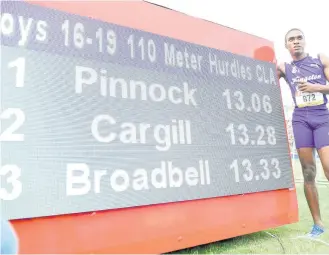  ?? Gladstone Taylor/Multimedia Photo Editor ?? Wayne Pinnock of Kingston College celebrates his record-breaking win in the Class 1 boys’ 110m hurdles final. Pinnock broke Calabar’s Dejour Russell’s record of 13.10 with a time of 13.06.