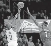  ?? [AP PHOTO] ?? Houston Rockets guard Chris Paul (3) shoots over Oklahoma City Thunder forward Carmelo Anthony (7) on Tuesday.