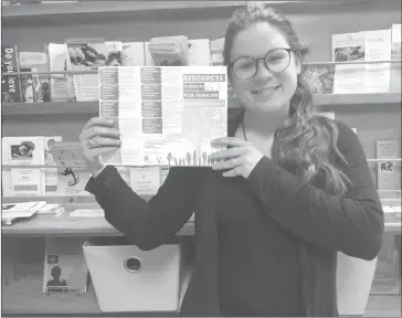  ?? TOWNSHIPPE­RS’ ASSOCIATIO­N ?? Emily Prangley Desormeaux shows the new free guide that will help English-speaking families in the Brome-missisquoi find local health and social services, and community organizati­ons that can serve them in English. Brochures can be picked up from...