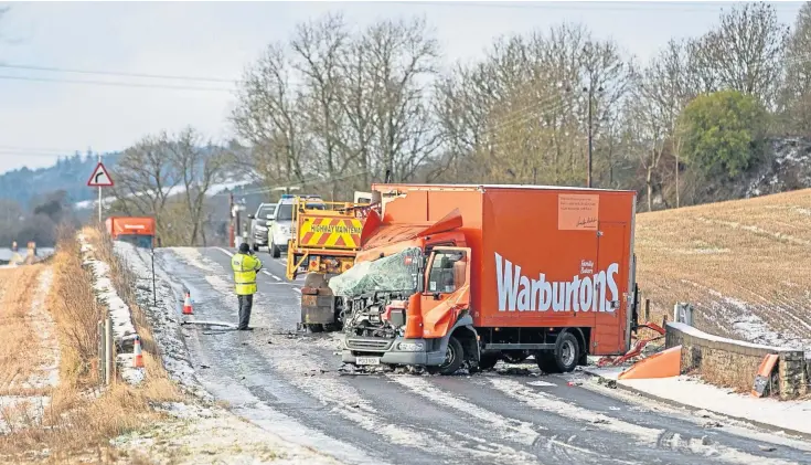  ??  ?? COLLISION: Two men were taken to Ninewells Hospital following the collision on the A91 involving a Warburtons van and a gritter. Pictures by Kim Cessford.