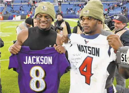  ?? KENNETH K. LAM/BALTIMORE SUN ?? Texans quarterbac­k Deshaun Watson, left, and Ravens quarterbac­k Lamar Jackson exchange jerseys after last season’s game in Baltimore.