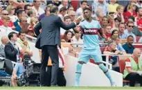  ?? Photo: LIVEPIC ?? Sixteen-year-old Reece Oxford is congratula­ted by West Ham manager Slaven Bilic as he is subbed late in yesterday’s game.