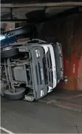  ?? NETWORK RAIL. ?? An HGV struck Running Horse Bridge in Swindon on October 30 2017, and overturned. More than 2,000 bridge strikes occur every year and RAIL readers are calling for greater efforts to be made to prevent them.