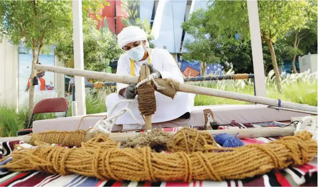  ?? Kamal Kassim / Gulf Today ?? ↑
The traditiona­l craft of weaving ropes has been displayed at Expo 2020 Dubai.