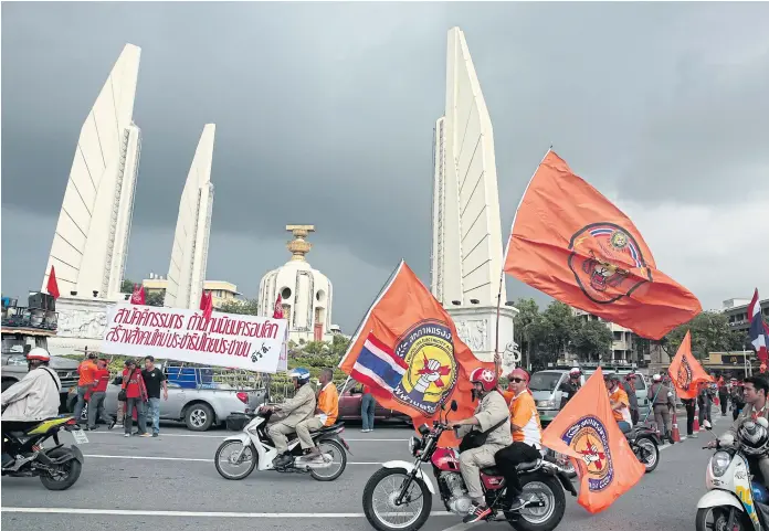  ??  ?? MOBILE RALLY: Thai labour representa­tives rally on May Day on the way to Government House.