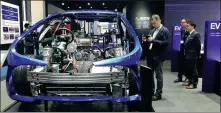  ?? LI FUSHENG / CHINA DAILY ?? Japan’s auto supplier Aisin shows its latest products at an expo in Shanghai in 2019. A CAAM poll shows carmakers and suppliers believe the coronaviru­s epidemic will wreak more havoc than the SARS outbreak on the auto industry.