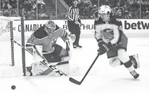  ?? JASON FRANSON/AP ?? The Blue Jackets’ Alexandre Texier is stopped by Edmonton goalie Stuart Skinner on Thursday.