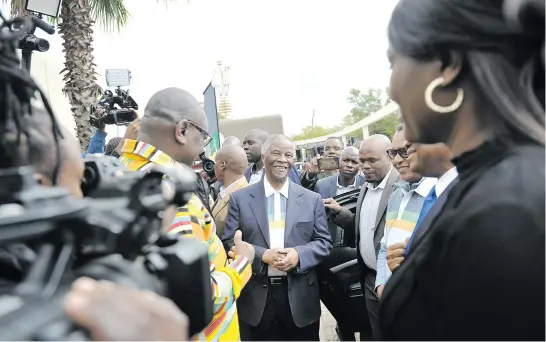  ?? Picture: Nigel Sibanda ?? WEARING THE COLOURS. Thabo Mbeki arrives at the ANC pavilion at the Rand Show as part of the party’s election campaign.