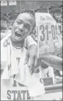  ?? Associated Press ?? Wichita State’s Nick Wiggins shows off the significan­ce of Saturday’s victory.