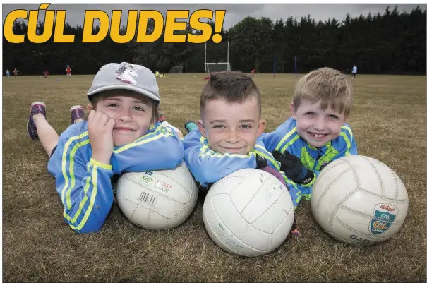  ??  ?? Zara O’Gorman, Louie Corcoran and Lucas O’Toole at the Kilcoole GAA Club Cúl Camp. Photo: Barbara Flynn