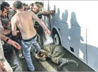  ?? Selcuk Samiloglu Associated Press ?? A SOLDIER accused in the coup attempt is attacked. Analysts warned Erdogan would consolidat­e his grip on power.