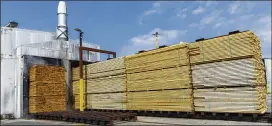  ?? KAREN E. SEGRAVE/NYT ?? Lumber at a dry kiln is shown at Resolute Forest Products in El Dorado, Ark. Constructi­on companies are paying more for lumber and hardware, and waiting weeks and sometimes months to receive what they need.